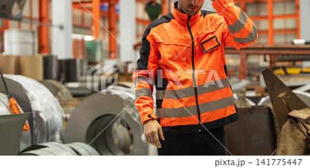 Male Industrial Worker in in Safety Protective Gear at Workplace. 141775447