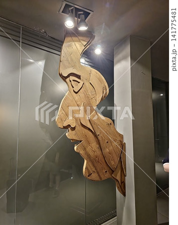 Buenos Aires, Argentina - March 29, 2026: Contemporary Wooden Sculpture Displayed Under Spotlights 141775481