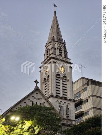 Buenos Aires, Argentina - March 28, 2026: Illuminated Clocks on Historic Church Tower Buenos Aires, Argentina - March 28, 2026: Illuminated Clocks on Historic Church Tower 141775490