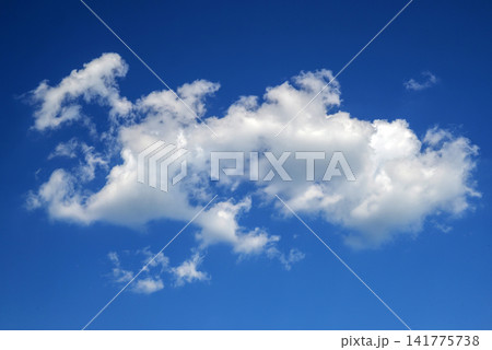 white fluffy cloud floating in clear blue sky white fluffy cloud floating in clear blue sky 141775738