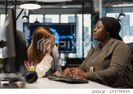 Friendly office senior team leader helping stressed intern at work, giving wise advice. Empathic manager at desk listening to exhausted worker suffering from burnout, giving motivational support Friendly office senior team leader helping stressed intern at work, giving wise advice. Empathic manager at desk listening to exhausted worker suffering from burnout, giving motivational support 141776430