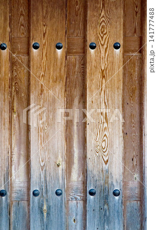 Weathered wooden door texture background 141777488