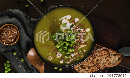 Overhead View of Green Pea Soup with Flaxseeds and Toasted Bread Overhead View of Green Pea Soup with Flaxseeds and Toasted Bread 141778011