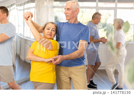 Couple of elderly man and woman dancing waltz Couple of elderly man and woman dancing waltz 141778130