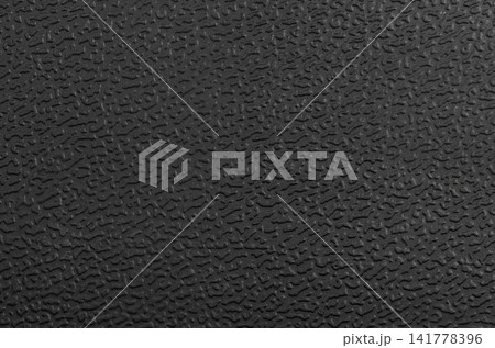 Black plastic surface Black plastic surface 141778396