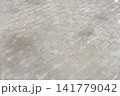 降り始めの雪が舞う石畳　背景素材 141779042