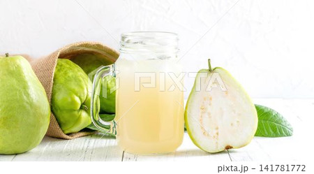 Fresh green apples and pear with juice on white background Fresh green apples and pear with juice on white background 141781772