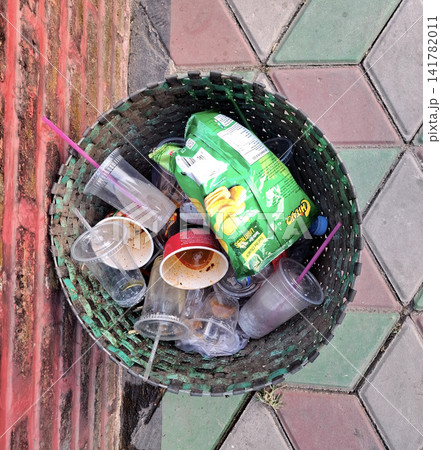 Boyolali, Indonesia - August 2nd 2026: Trash bin full of plastic waste and disposable cups, highlighting environmental pollution. 141782011
