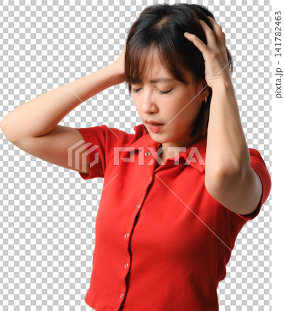 Asian woman experiencing headache while holding head in pain against isolated background with red shirt and emotional expression Asian woman experiencing headache while holding head in pain against isolated background with red shirt and emotional expression 141782463