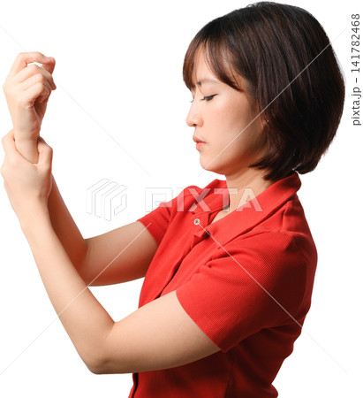 Asian woman examining wrist with focused expression against transparent background 141782468