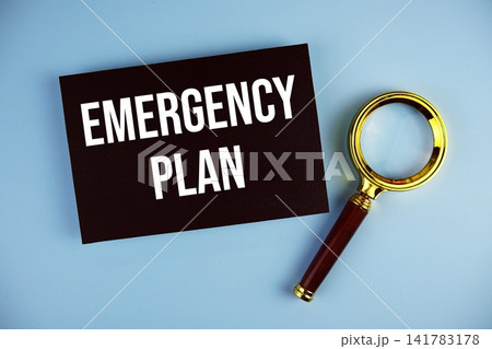 Emergency Plan text with Magnifying glass on blue background 141783178