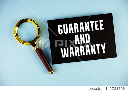 Guarantee And Warranty text with Magnifying glass on blue background Guarantee And Warranty text with Magnifying glass on blue background 141783206