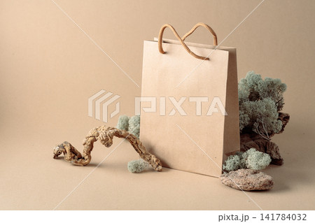 Paper bag and natural dry snags and moss. Paper bag and natural dry snags and moss. 141784032