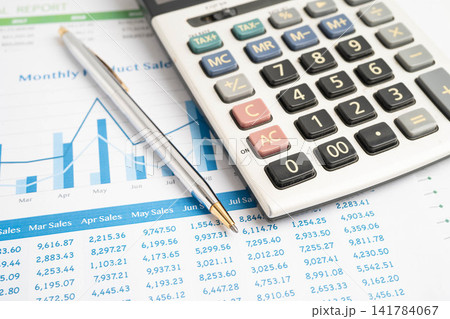 Calculator with pen on data business graphs paper. Calculator with pen on data business graphs paper. 141784067
