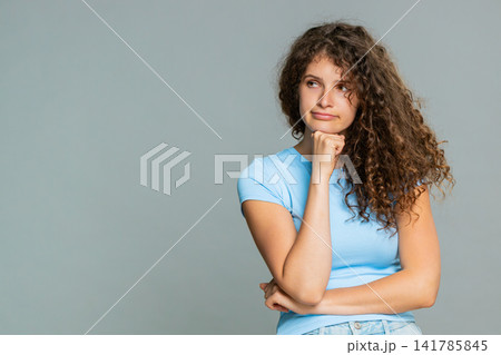 Young woman bored uninterested emotion indifferent face tired dull mood dissatisfied expression look Young woman bored uninterested emotion indifferent face tired dull mood dissatisfied expression look 141785845
