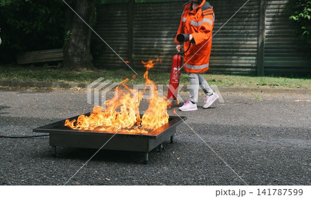 fire prevention. corporate safety - exercise during a firefighting course 141787599