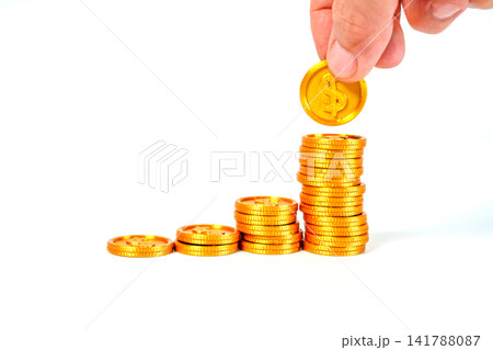 Person hand putting gold dollar coin on rising stack of coins. Concept of financial growth, savings, and investment success. Professional business and economy photography on white background. Person hand putting gold dollar coin on rising stack of coins. Concept of financial growth, savings, and investment success. Professional business and economy photography on white background. 141788087