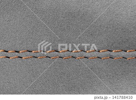 Elegant warm Gray suede surface with decorative stitch for design Elegant warm Gray suede surface with decorative stitch for design 141788410