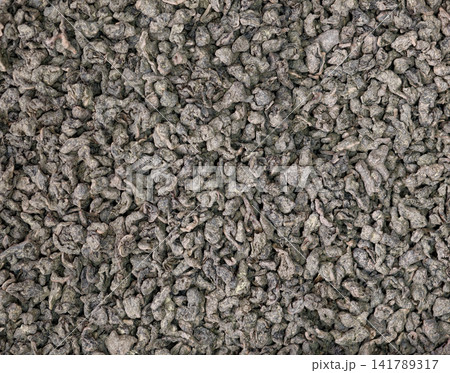 Close-up texture of dried rolled oolong tea leaves background 141789317