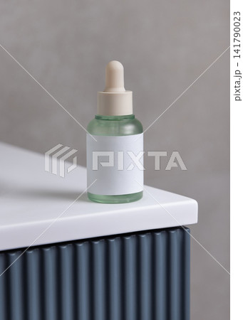 White spray cosmetic bottle mockup on blue bathroom vanity. Skincare cosmetic packaging White spray cosmetic bottle mockup on blue bathroom vanity. Skincare cosmetic packaging 141790023