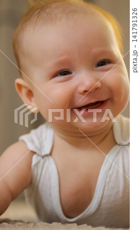 Adorable baby smiling, feeling happiness and joy 141791326