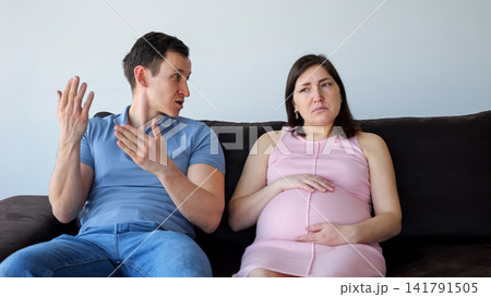 Pregnant woman and man having relationship problems, conflict at home Pregnant woman and man having relationship problems, conflict at home 141791505