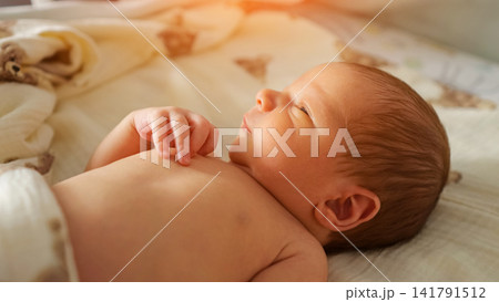 Newborn baby sleeping peacefully creating innocence and childhood concept Newborn baby sleeping peacefully creating innocence and childhood concept 141791512
