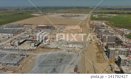 Industrial construction site with construction equipment and materials Industrial construction site with construction equipment and materials 141792427