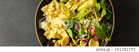 Millet porridge sits beside baked zucchini and beets. A salad made with spinach, arugula, and pink radish adds crunch with nuts and seeds. A wholesome meal for any time, banner Millet porridge sits beside baked zucchini and beets. A salad made with spinach, arugula, and pink radish adds crunch with nuts and seeds. A wholesome meal for any time, banner 141792775