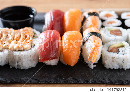 Assorted sushi platter with nigiri and rolls Assorted sushi platter with nigiri and rolls 141792812