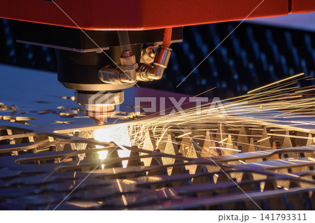 Sparkling light and sparks from fiber laser cutting machine engraving metal plate Sparkling light and sparks from fiber laser cutting machine engraving metal plate 141793311