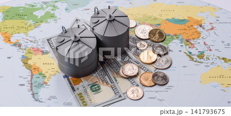 Liquefied gas storage tanks set against the world map as a background for your design Liquefied gas storage tanks set against the world map as a background for your design 141793675