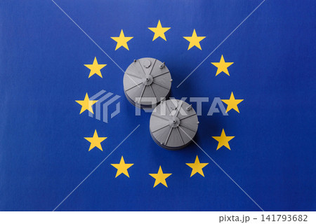 Liquefied gas storage tanks set against the EU flag as a background for your design 141793682