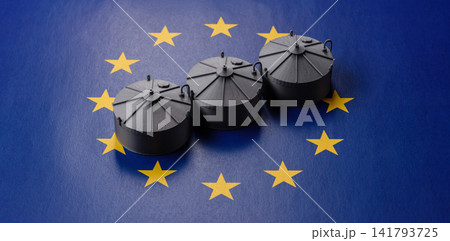 Liquefied gas storage tanks set against the EU flag as a background for your design 141793725