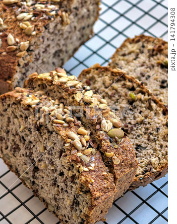 Sliced Keto Bread Loaf Displaying Dense Seeded Crumb 141794308