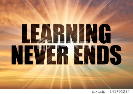 Learning never ends conceptual phrase on a golden evening sky with bright sun rays Learning never ends conceptual phrase on a golden evening sky with bright sun rays 141795254