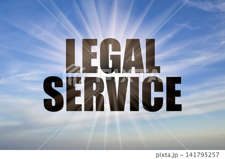 Legal service conceptual phrase against a clear blue daytime sky with bright sun rays Legal service conceptual phrase against a clear blue daytime sky with bright sun rays 141795257