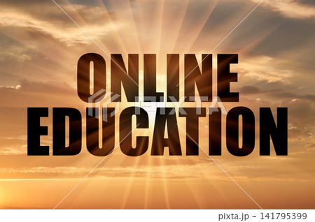 Online education black text against a dramatic cloudy evening sky with sun rays Online education black text against a dramatic cloudy evening sky with sun rays 141795399