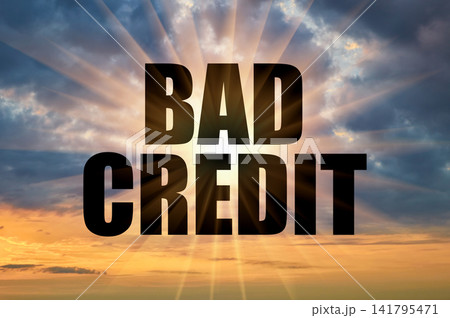Bad credit conceptual phrase on a dramatic cloudy evening sky Bad credit conceptual phrase on a dramatic cloudy evening sky 141795471