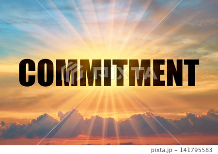 Commitment conceptual word on a beautiful colorful glowing sky with sun rays Commitment conceptual word on a beautiful colorful glowing sky with sun rays 141795583