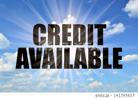 Credit available conceptual phrase on a bright blue daytime sky with sun rays 141795617