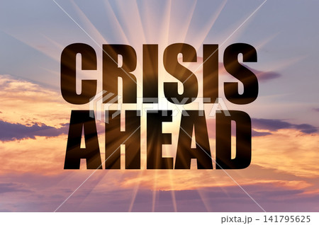 Crisis ahead text against golden sun rays in evening sky Crisis ahead text against golden sun rays in evening sky 141795625