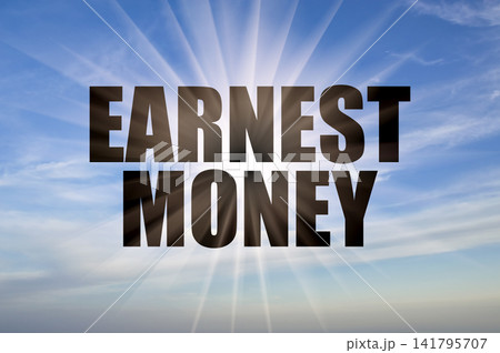 Earnest money text against bright sun rays in clear blue sky Earnest money text against bright sun rays in clear blue sky 141795707
