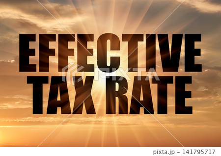 Effective tax rate text against golden sun rays in evening sky Effective tax rate text against golden sun rays in evening sky 141795717