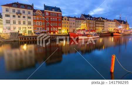 Nyhavn harbor panorama with colorful waterfront buildings at dawn in Copenhagen Denmark Nyhavn harbor panorama with colorful waterfront buildings at dawn in Copenhagen Denmark 141798295