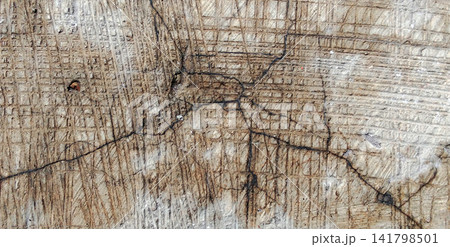 Cracked concrete surface with a grid texture and scratches. 141798501