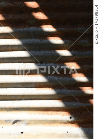 old zinc metal roof background with sunlight, construction industry old zinc metal roof background with sunlight, construction industry 141798814