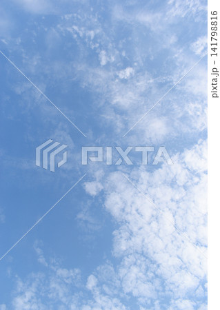 beautiful blue sky and white fluffy group of clouds with sunrise in the morning, natural background 141798816