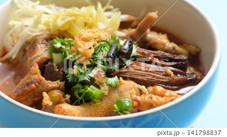 rice vermicelli with northern thai curry sauce on blue background rice vermicelli with northern thai curry sauce on blue background 141798837