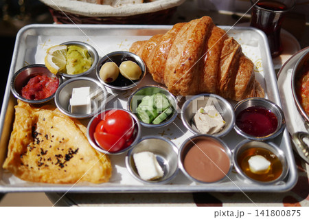 Breakfast platter with croissant and various sides Breakfast platter with croissant and various sides 141800875